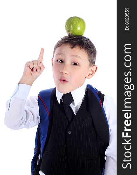 Schoolboy with backpack and apple isolated on white