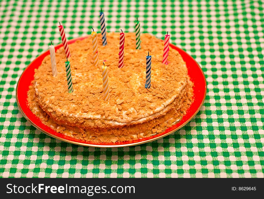 Cake with candles on the table