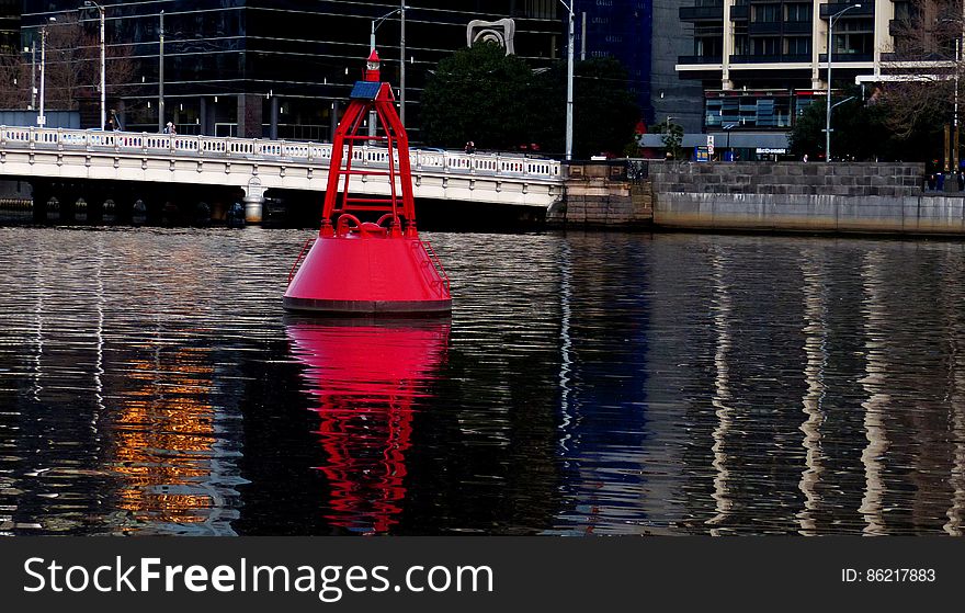 A Nun Buoy marks the Left side of the channel leaving the harbor. It will be red and have even numbers on it. Red Daymarkers are often used in shallow areas for the same purpose.. If the red marker has pilings supporting it, it will be called a dolphin. Red buoys with lights will usually be found in deeper water. The light will be red. Larger buoys may also have bells, horns or other sound producing devices. A Nun Buoy marks the Left side of the channel leaving the harbor. It will be red and have even numbers on it. Red Daymarkers are often used in shallow areas for the same purpose.. If the red marker has pilings supporting it, it will be called a dolphin. Red buoys with lights will usually be found in deeper water. The light will be red. Larger buoys may also have bells, horns or other sound producing devices.