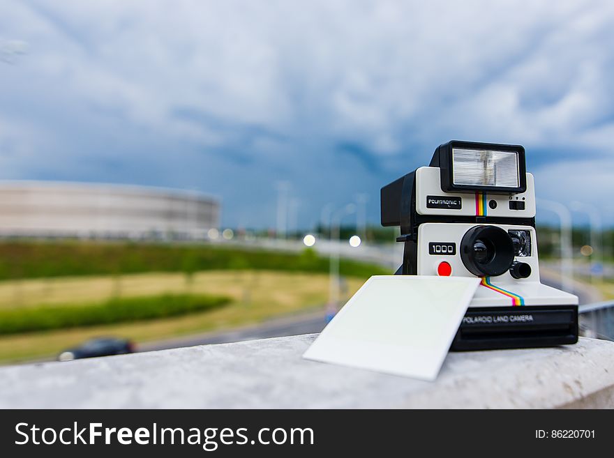 Black and White Polaroid Instant Camera With Photo Paper