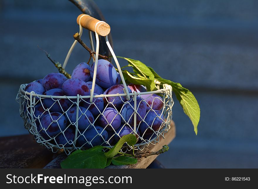 Red Grape Fruits on Metal Basket