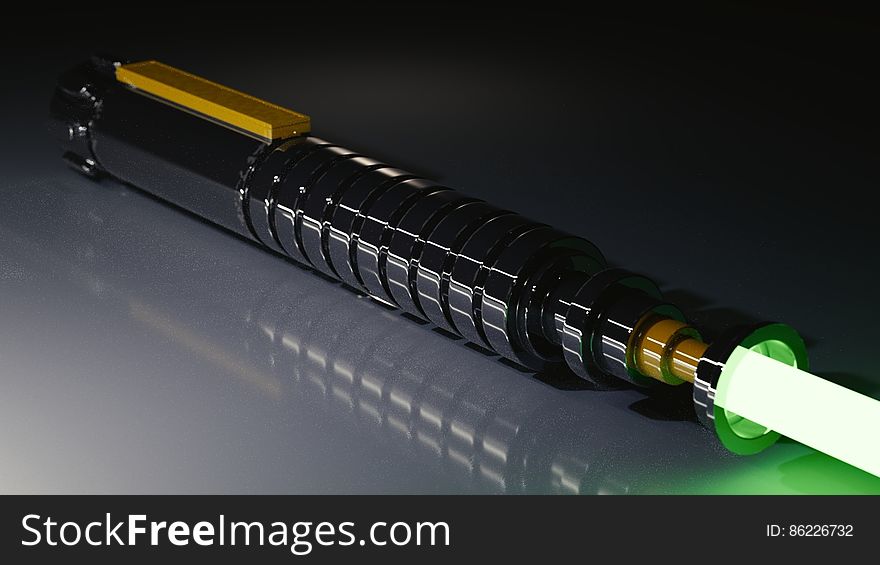 Close up of laser light pen with beam reflecting on tabletop. Close up of laser light pen with beam reflecting on tabletop.