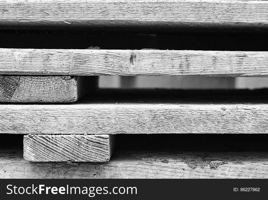 A black and white background of industrial wood.