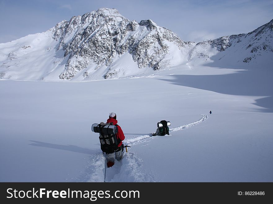 Hiker In Snow On Mountains