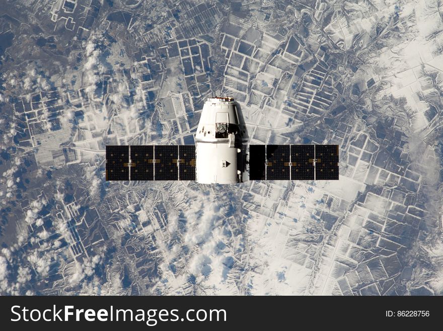 Spacex satellite orbiting from above. Spacex satellite orbiting from above.