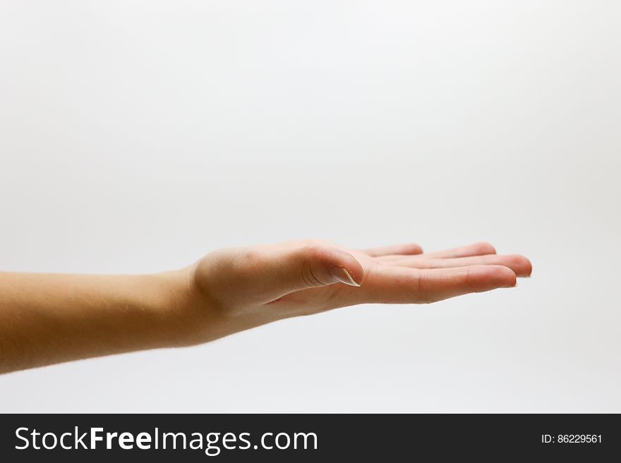 Close-up of Hand over White Background