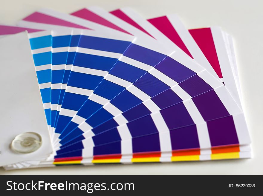 Fan of color samples in blue, purple, red and yellow.