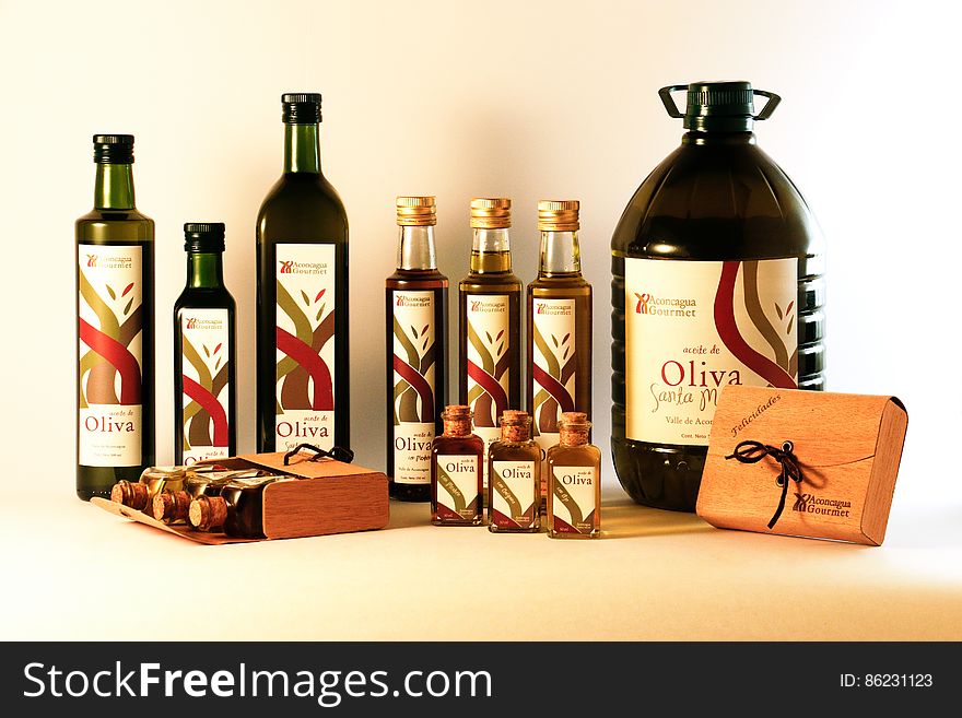 Bottles of olive oil in variety of shapes and sizes.