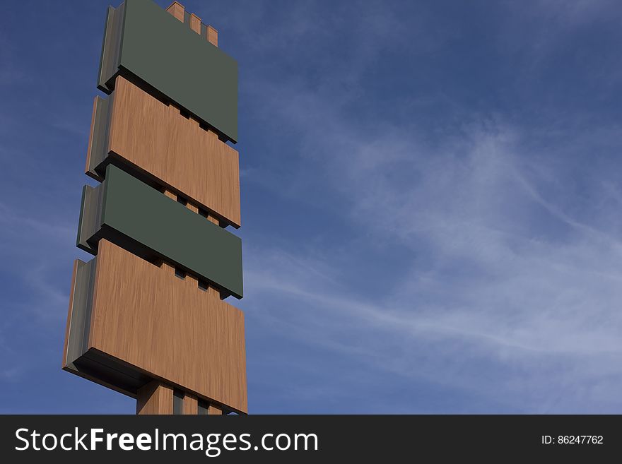 Blank wooden billboard against blue skies with clouds. Blank wooden billboard against blue skies with clouds.