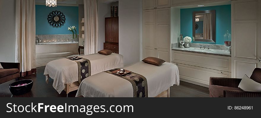 Twin beds in a luxurious modern hotel bedroom. Twin beds in a luxurious modern hotel bedroom.