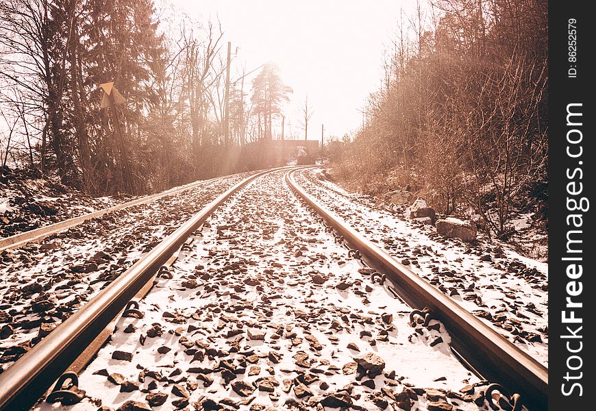 Railroad Tracks Against Sky During Winter