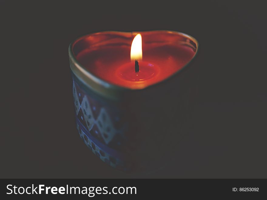 Close-up of Tea Light Candle Against Black Background