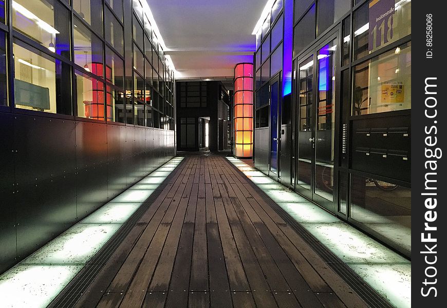 Colorful lights inside hallway through modern building. Colorful lights inside hallway through modern building.