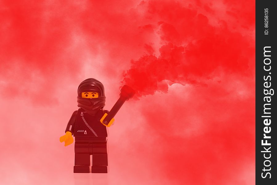Lego Mini Figure Character in Red Smoke