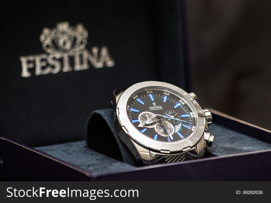 A close up of a luxury analog men's wrist watch. A close up of a luxury analog men's wrist watch.