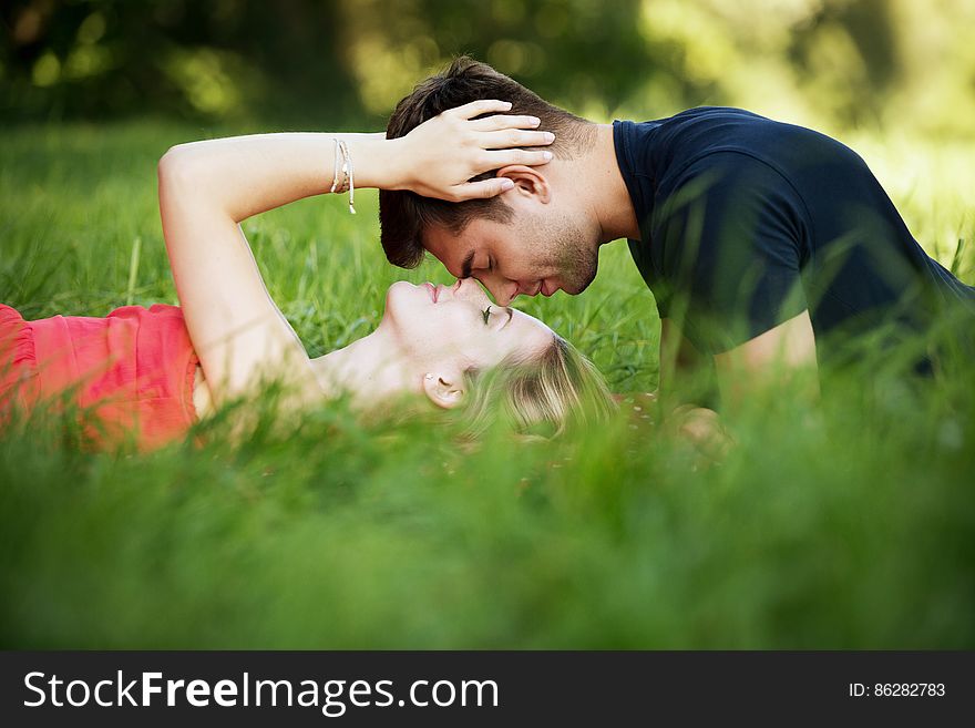 Couple Lying In Grass