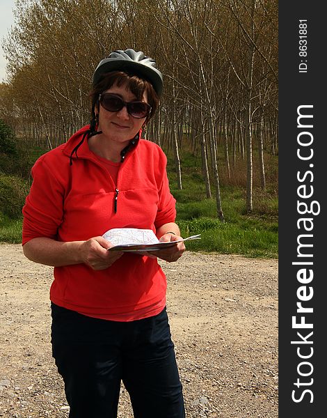 Woman Cyclist Reading Map