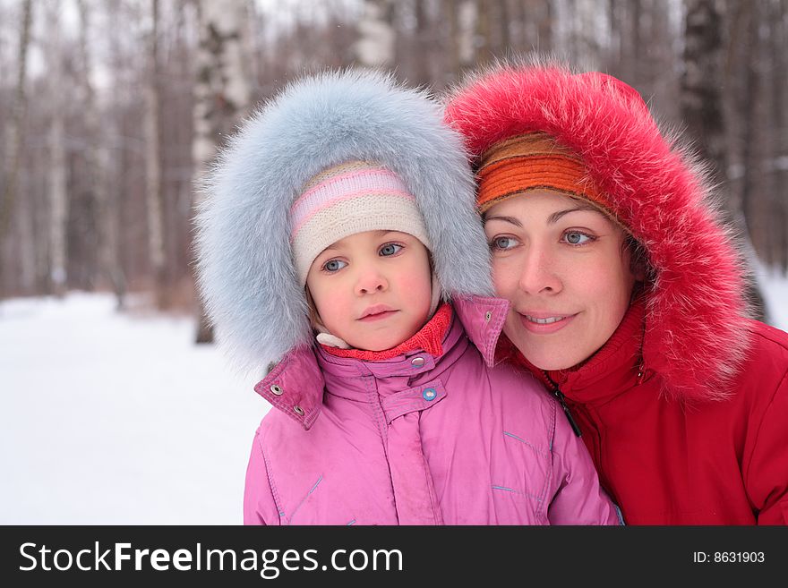 Mother with child in wood in winter. Mother with child in wood in winter
