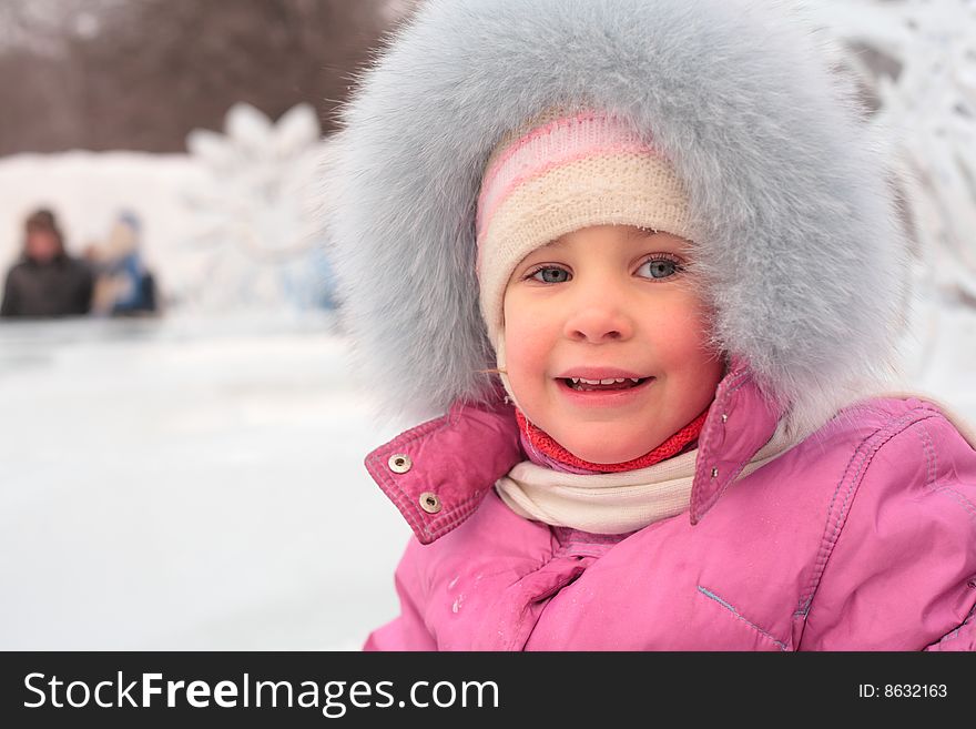 Little girl outdoors in winter, day
