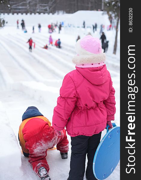 Children On Ice Slope In Park