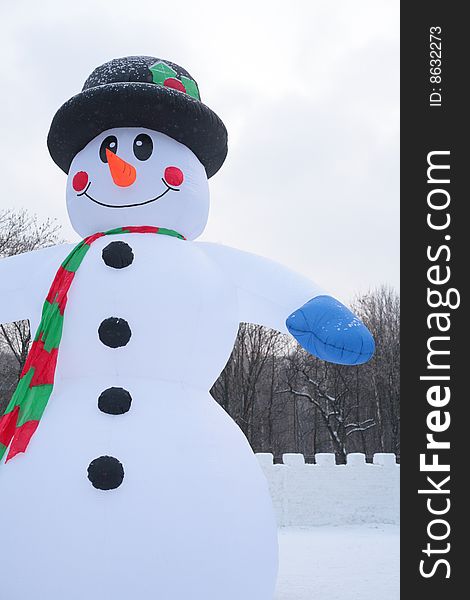 Inflatable snowman in park, winter