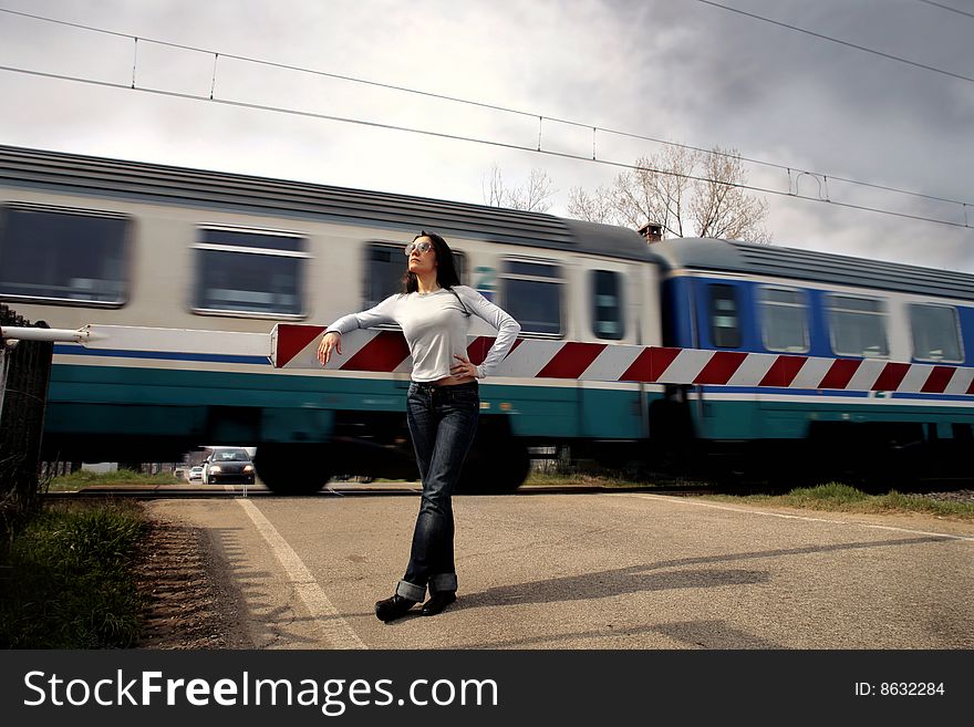 A girl against passing train