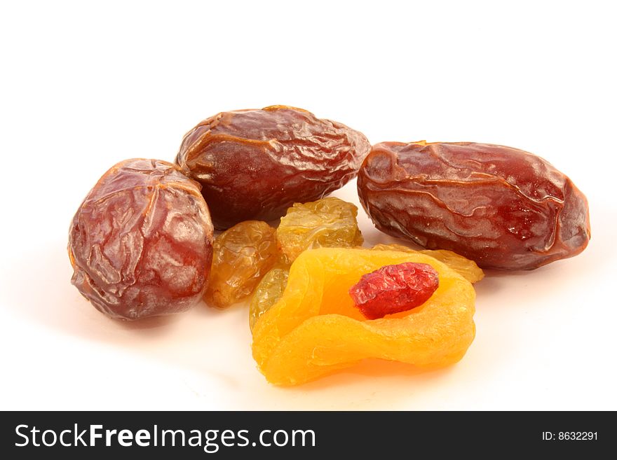 Dried raisin, dates,apricot, cranberry on a white background. Dried raisin, dates,apricot, cranberry on a white background.