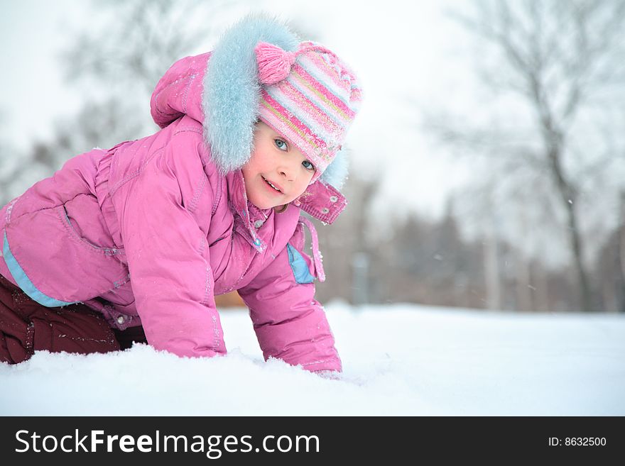 Little girl on snow, day
