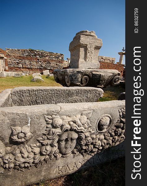 A carved limestone sarcophagus, featuring the head of a woman in the grounds of the Church of St John, Selcuk, Turkey. A carved limestone sarcophagus, featuring the head of a woman in the grounds of the Church of St John, Selcuk, Turkey