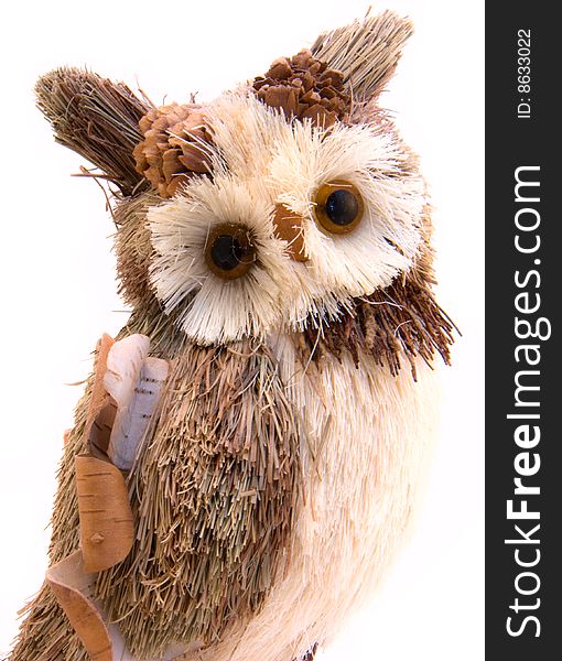 Brown toy owl isolated on a white background