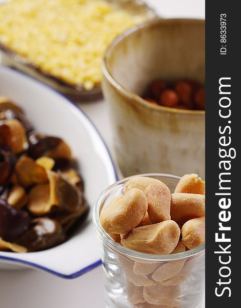 Various kind of peanut and fava bean in different cup and bowl. Various kind of peanut and fava bean in different cup and bowl.