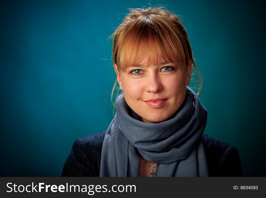 Portrait of female on a blue background in studio