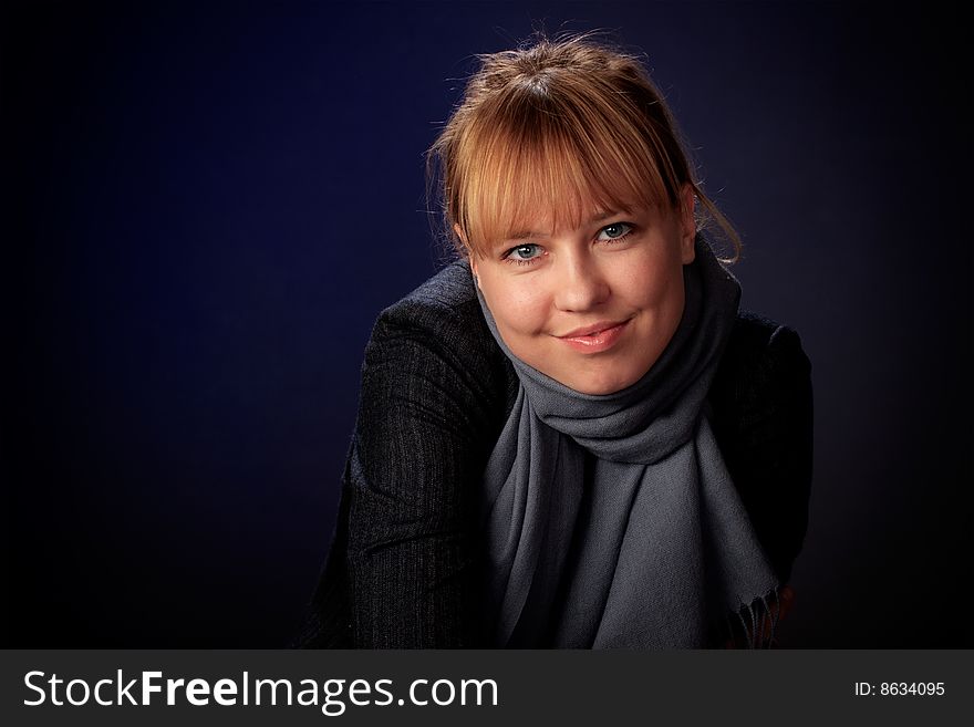 Portrait of female on a blue background in studio