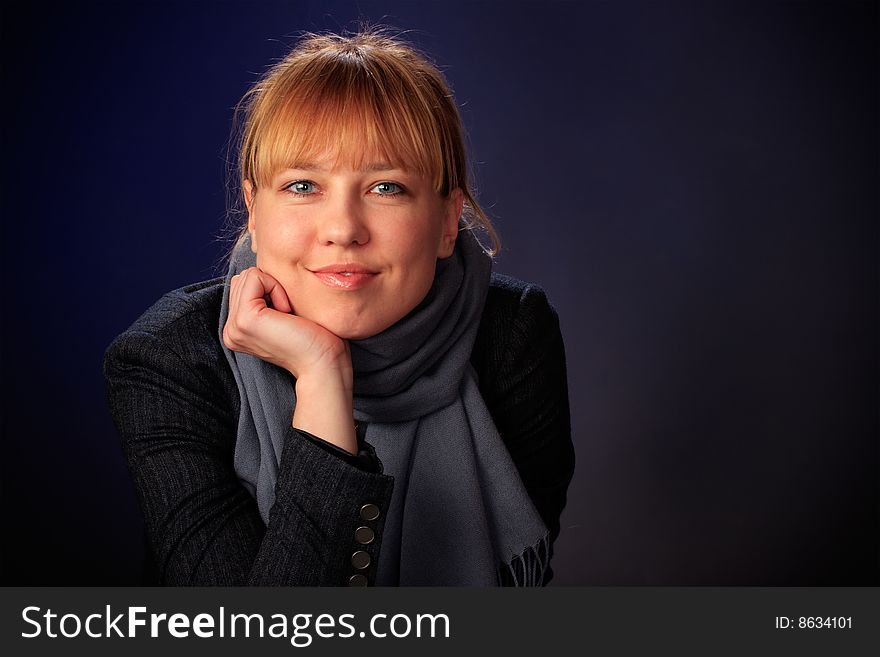 Portrait of female on a blue background in studio