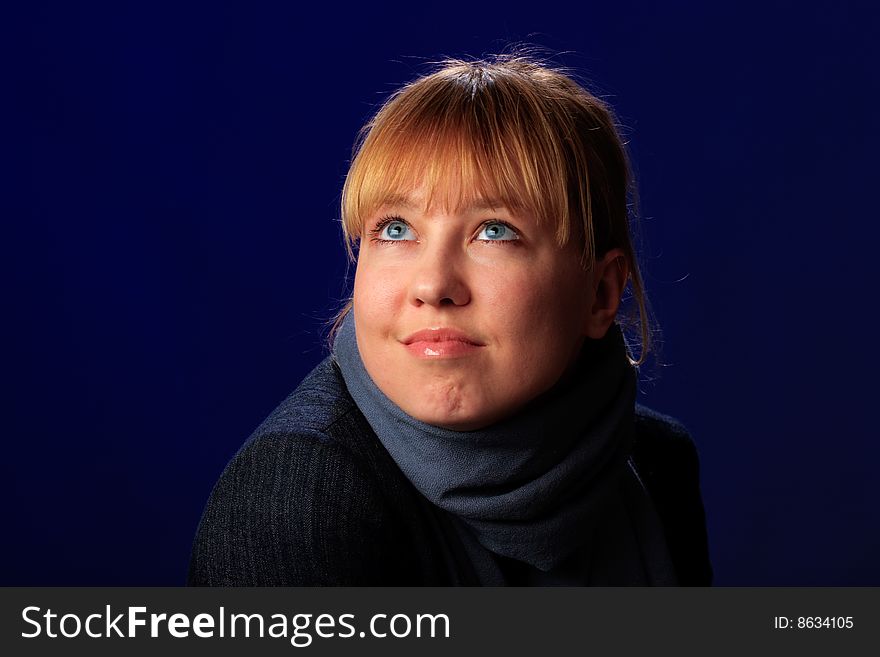 Portrait of female on a blue background in studio