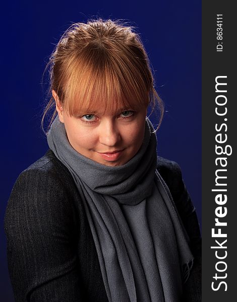 Portrait of female on a blue background in studio