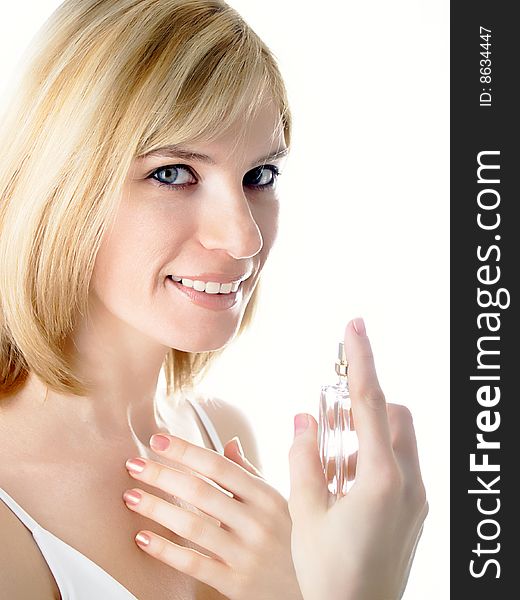 The beautiful girl with a cosmetics jar in a hand