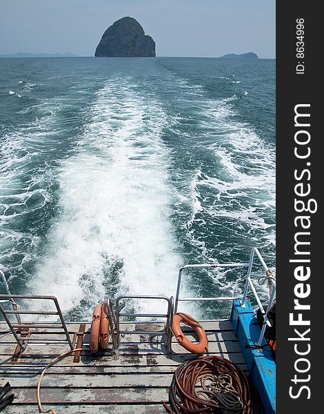 Island in sea of southern Thailand. View from back of boat. Island in sea of southern Thailand. View from back of boat.