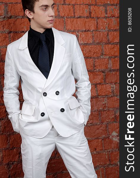 The young man in a white suit. The young man in a white suit