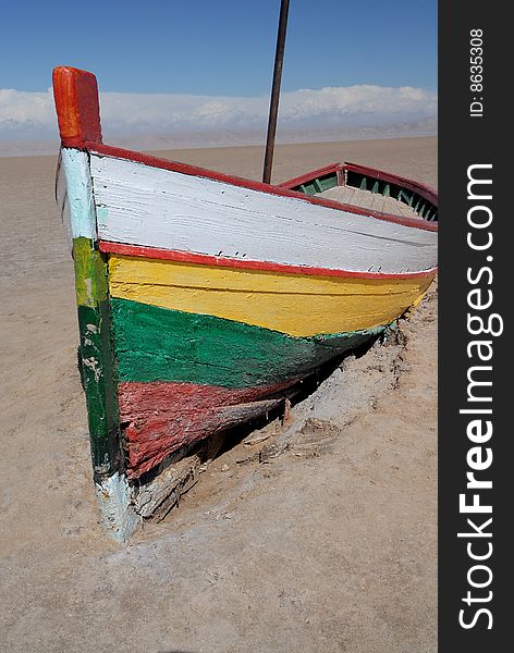 Lonely color boat in sand of desert. Lonely color boat in sand of desert