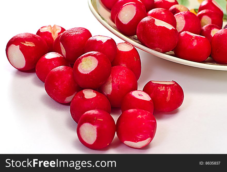 Garden radishes on plate isolated