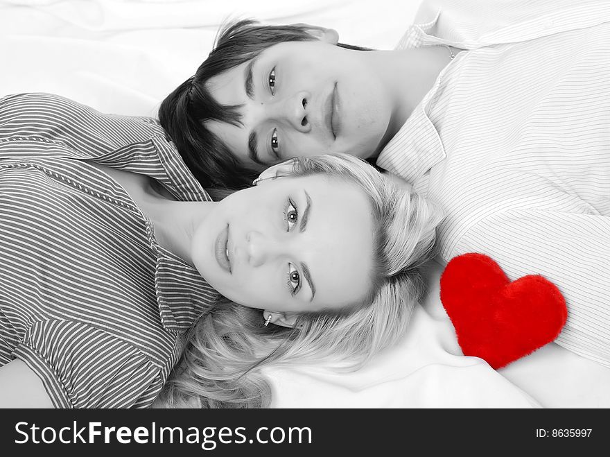 Young loving couple isolated at white background