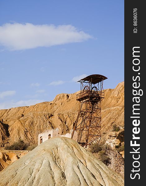 Abandoned old mining machinery in desert.