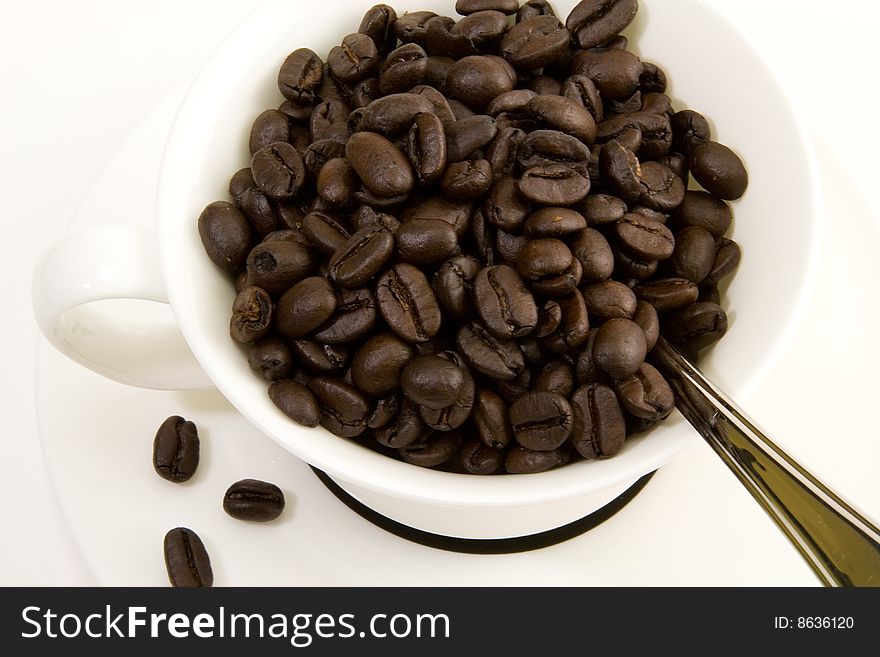 A cup of fresh Columbian coffee beans. A cup of fresh Columbian coffee beans