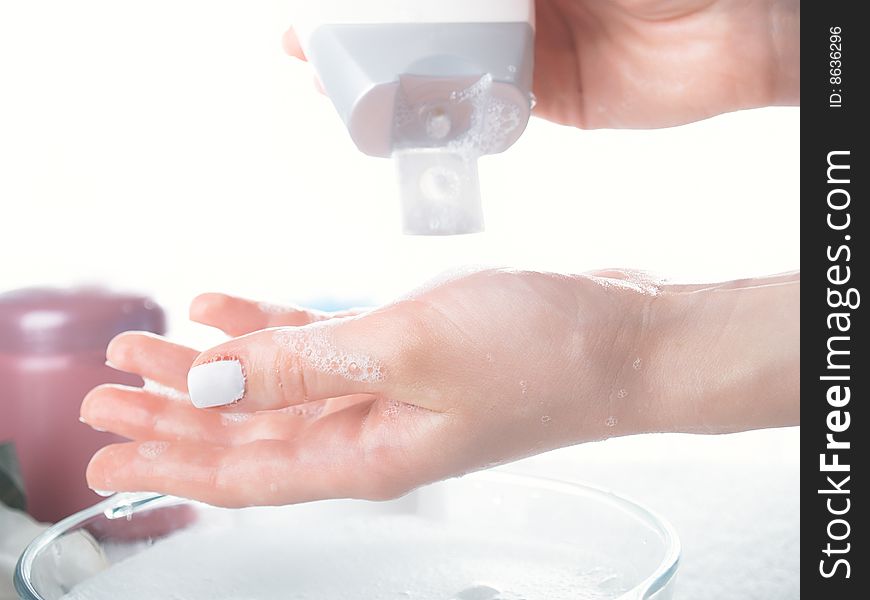 Foam of soap and female hands. Foam of soap and female hands