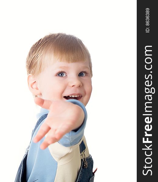 The child laughs at a white background