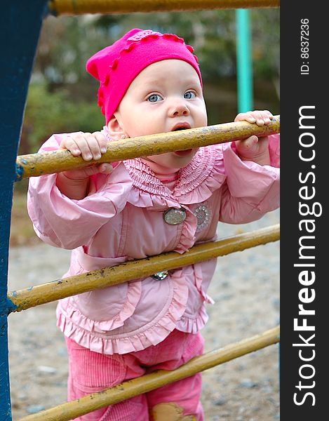 Pretty little girl on child s playground.