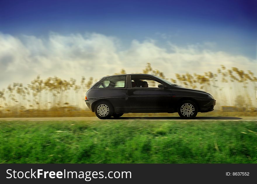 Woman driving a car in the nature