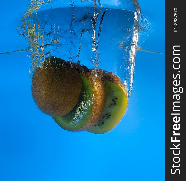 Kiwi in water on a blue background