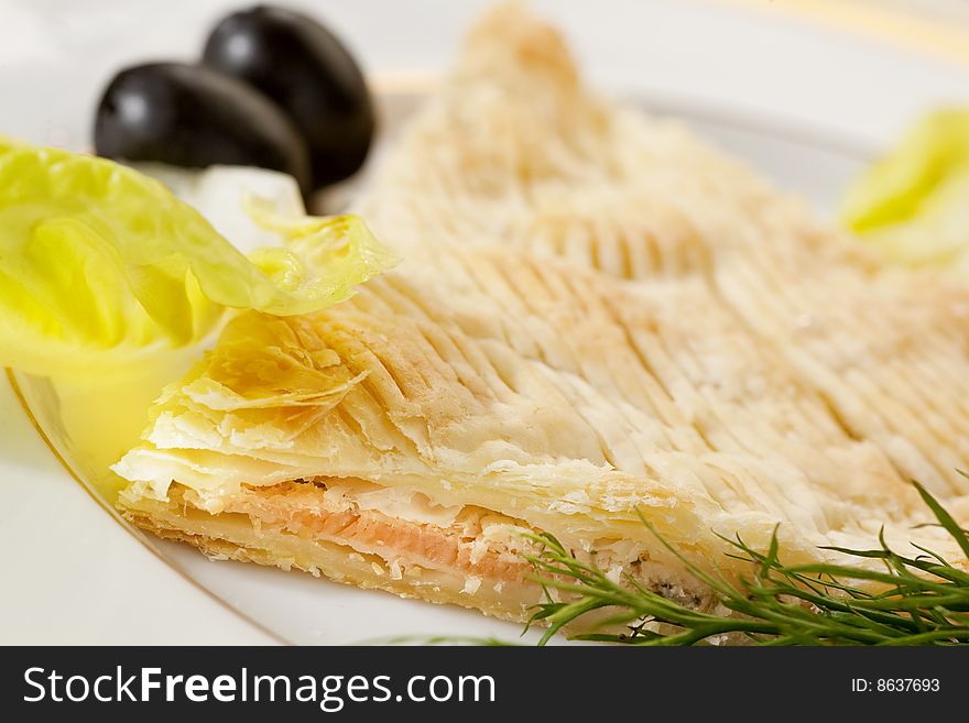 Casserole with salmon on white plate